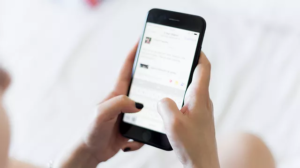 picture of a woman holding a cell phone